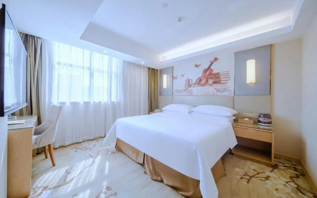 Bed in Vienna Hotel Shenzhen Guanlan Shanshuitianyuan Xintian