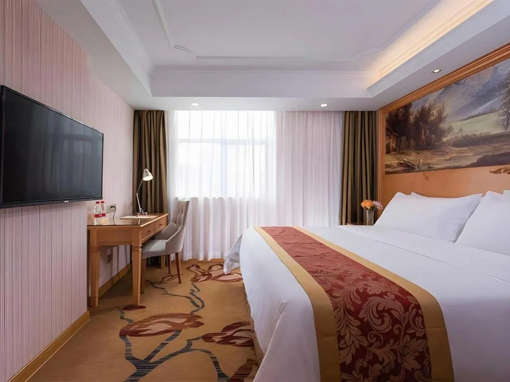 Bed in Vienna Hotel Shenzhen Guanlan Shanshuitianyuan Xintian