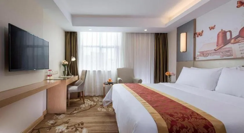 Bed in Vienna Hotel Shenzhen Guanlan Shanshuitianyuan Xintian