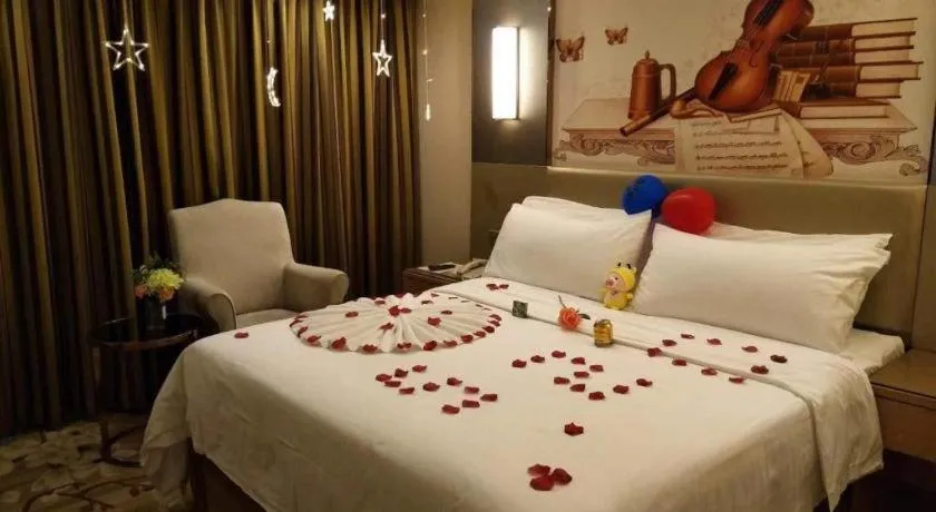 Bed in Vienna Hotel Shenzhen Guanlan Shanshuitianyuan Xintian