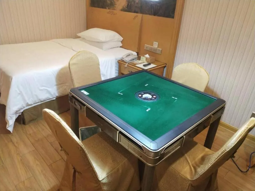 Bed in Vienna Hotel Shenzhen Guanlan Shanshuitianyuan Xintian