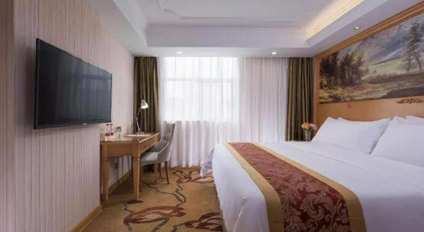 Bed in Vienna Hotel Shenzhen Guanlan Shanshuitianyuan Xintian