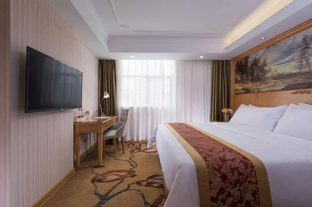 Bed in Vienna Hotel Shenzhen Guanlan Shanshuitianyuan Xintian