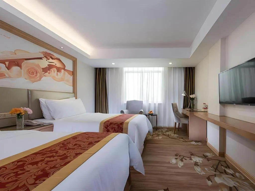 Bed in Vienna Hotel Shenzhen Guanlan Shanshuitianyuan Xintian