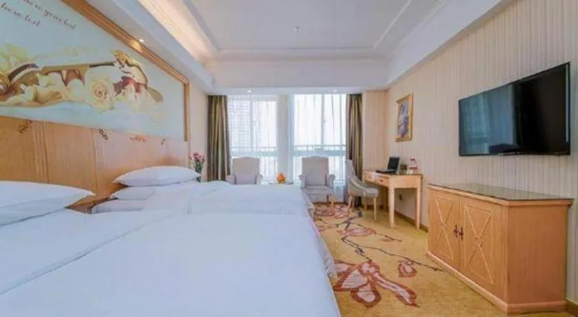 Bed in Vienna Hotel Wuhan Huazhong Normal University Huquan Metro Station