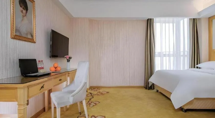 Bed in Vienna Hotel Wuhan Huazhong Normal University Huquan Metro Station