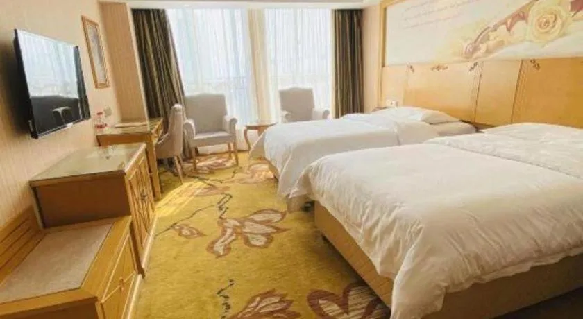 Bed in Vienna Hotel Wuhan Huazhong Normal University Huquan Metro Station