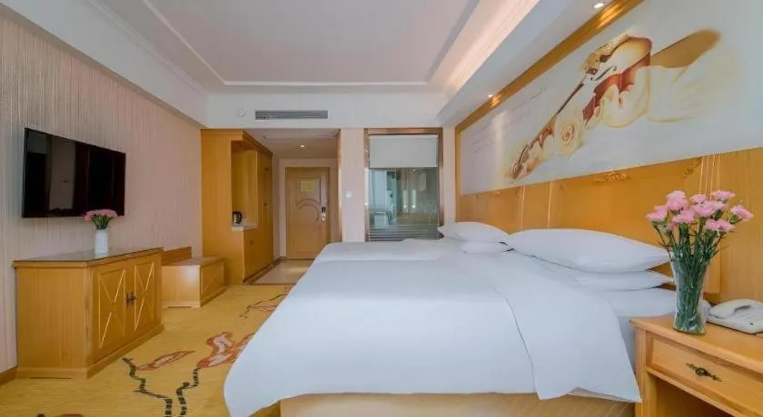 Bed in Vienna Hotel Wuhan Huazhong Normal University Huquan Metro Station