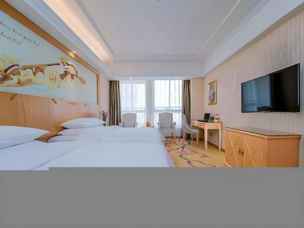 Bed in Vienna Hotel Wuhan Huazhong Normal University Huquan Metro Station