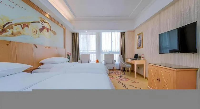 Bed in Vienna Hotel Wuhan Huazhong Normal University Huquan Metro Station