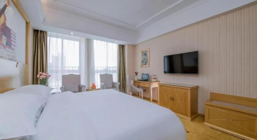 Bed in Vienna Hotel Wuhan Huazhong Normal University Huquan Metro Station