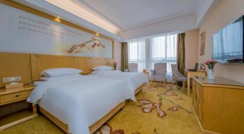 Bed in Vienna Hotel Wuhan Huazhong Normal University Huquan Metro Station