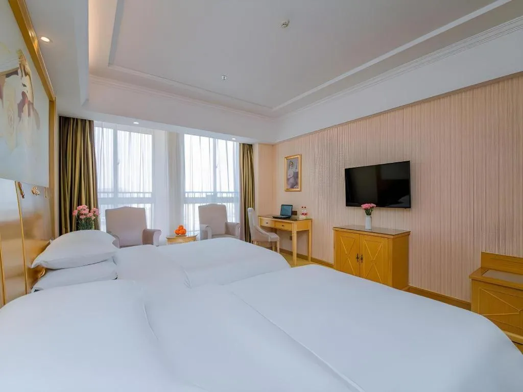 Bed in Vienna Hotel Wuhan Huazhong Normal University Huquan Metro Station