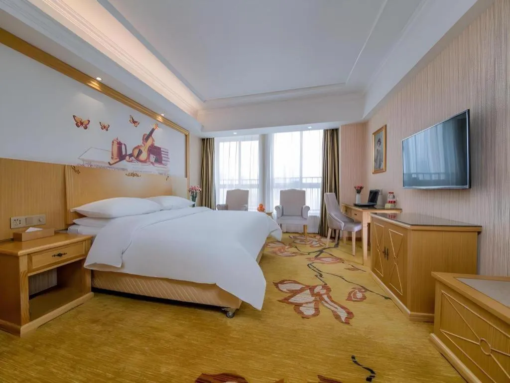 Bed in Vienna Hotel Wuhan Huazhong Normal University Huquan Metro Station