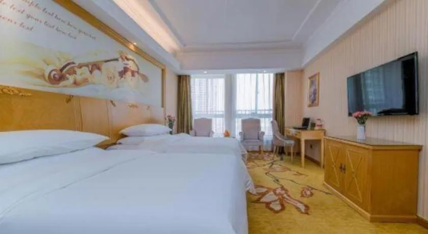 Bed in Vienna Hotel Wuhan Huazhong Normal University Huquan Metro Station