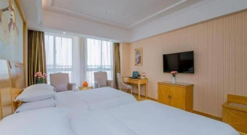 Bed in Vienna Hotel Wuhan Huazhong Normal University Huquan Metro Station