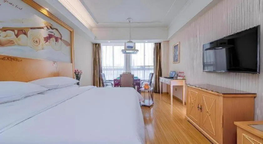 Bed in Vienna Hotel Wuhan Huazhong Normal University Huquan Metro Station