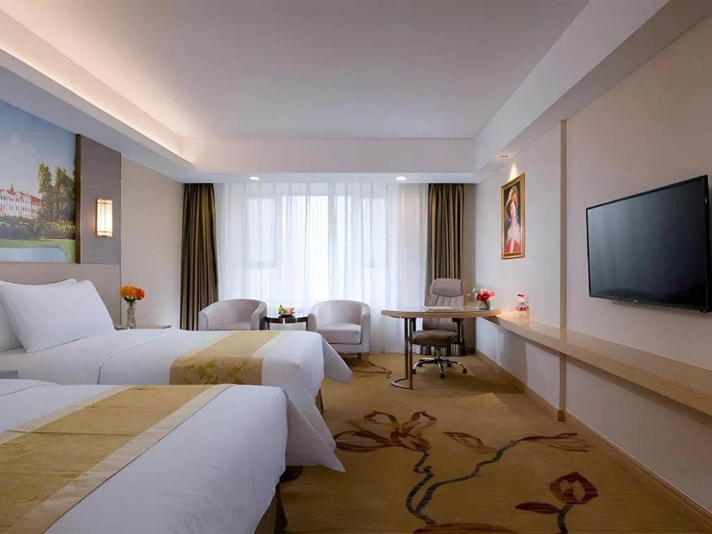 Bed in Vienna Hotel Shandong Jinan High-Tech Wanda Exhibition Center