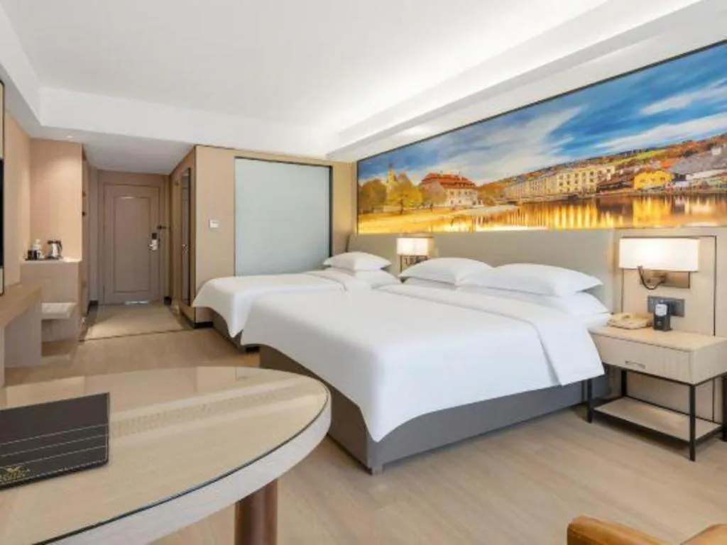 Bed in Vienna Hotel Shandong Jinan High-Tech Wanda Exhibition Center