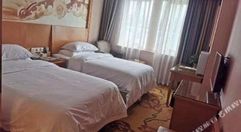 Bed in Vienna Hotel Zhejiang Ningbo Beilun In Time City
