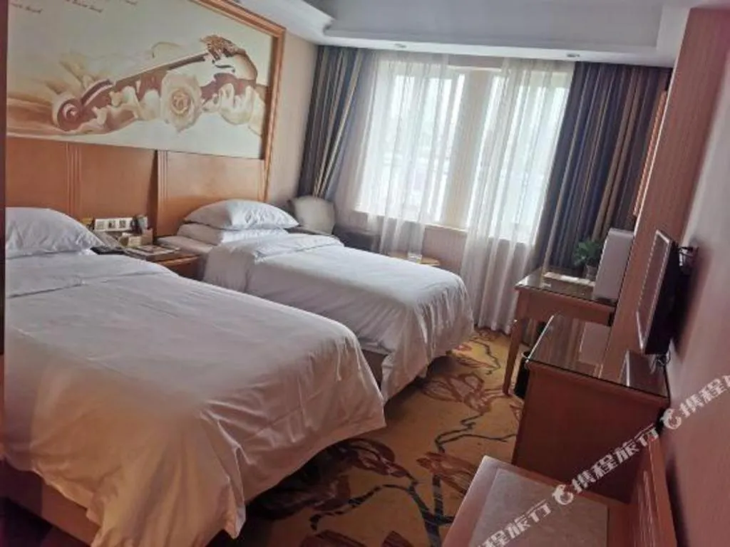 Bed in Vienna Hotel Zhejiang Ningbo Beilun In Time City