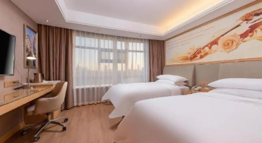 Bed in Vienna Hotel Tianjin Olympic Sports Center Tianta