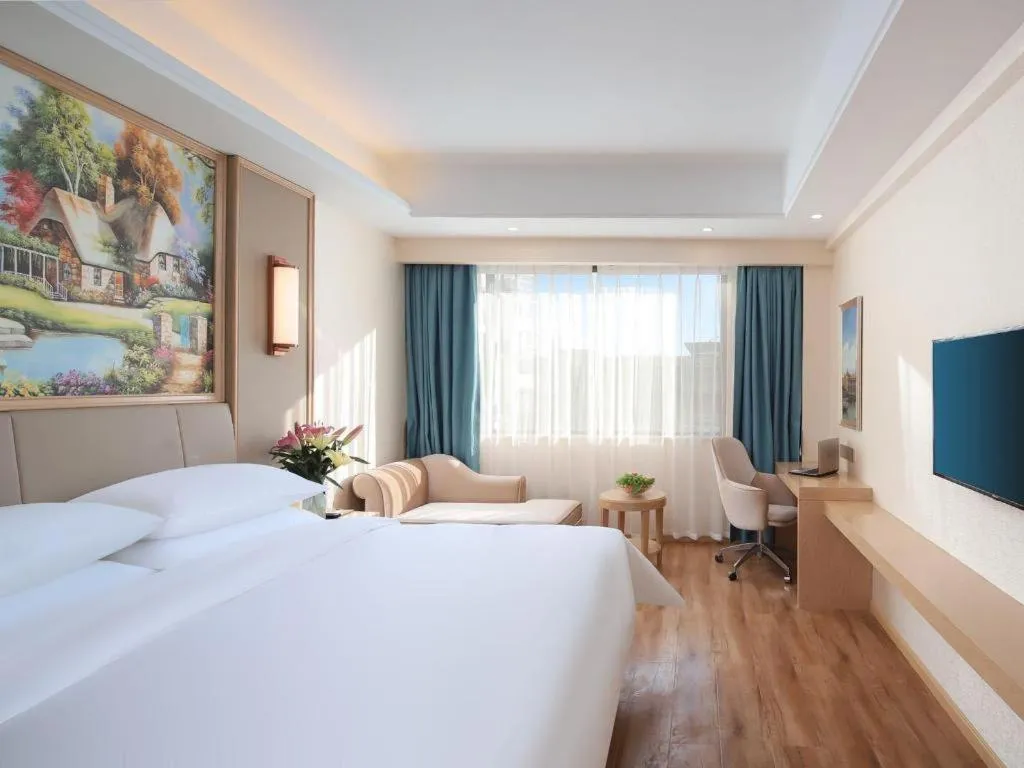 Bed in Vienna Hotel Kunming Baiyun Road Metro Station Jiang'an