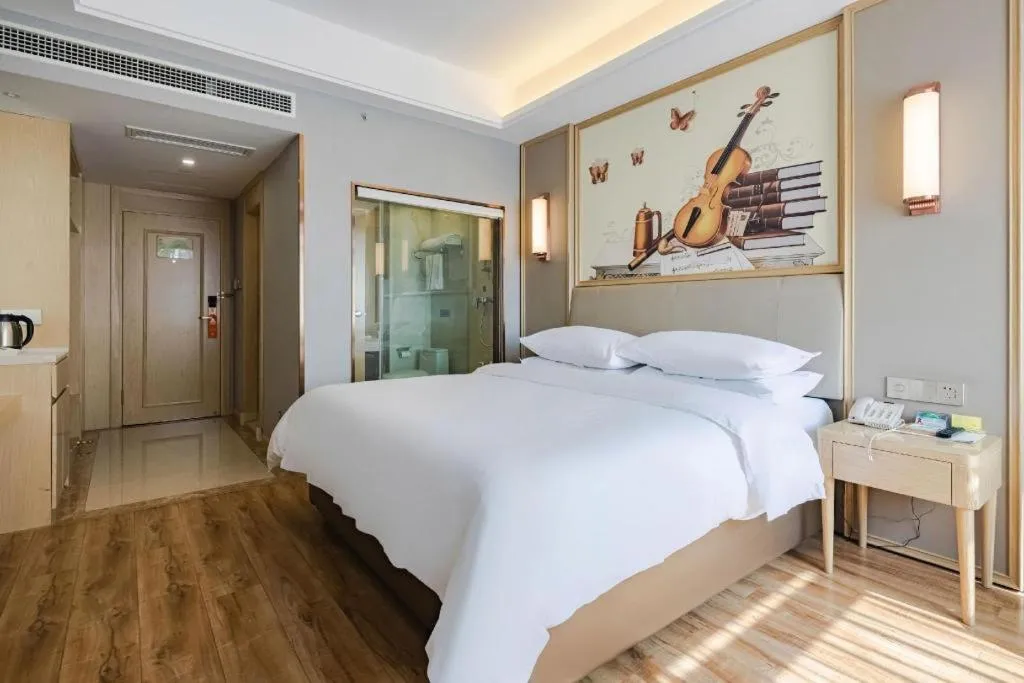 Bed in Vienna Hotel Kunming Baiyun Road Metro Station Jiang'an