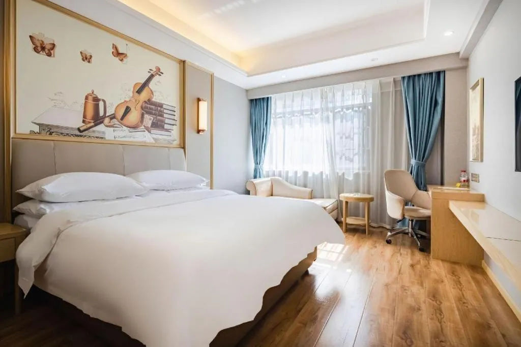 Bed in Vienna Hotel Kunming Baiyun Road Metro Station Jiang'an