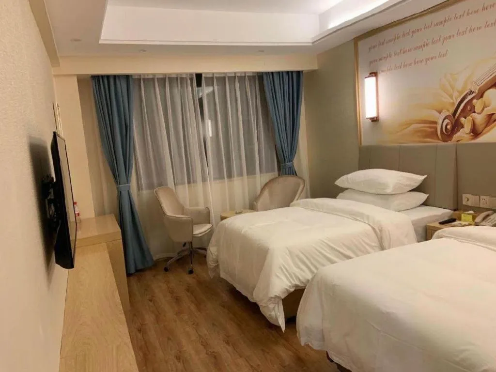 Bed in Vienna Hotel Kunming Baiyun Road Metro Station Jiang'an