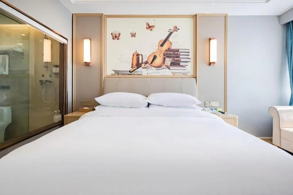 Bed in Vienna Hotel Kunming Baiyun Road Metro Station Jiang'an