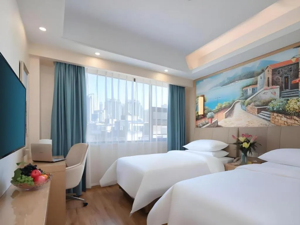 Bed in Vienna Hotel Kunming Baiyun Road Metro Station Jiang'an
