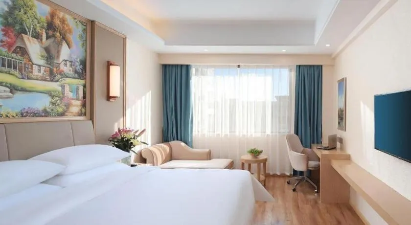 Bed in Vienna Hotel Kunming Baiyun Road Metro Station Jiang'an