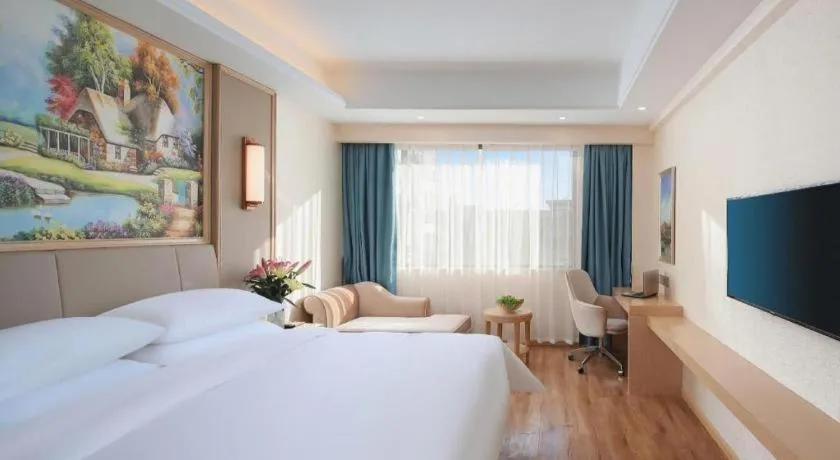 Bed in Vienna Hotel Kunming Baiyun Road Metro Station Jiang'an