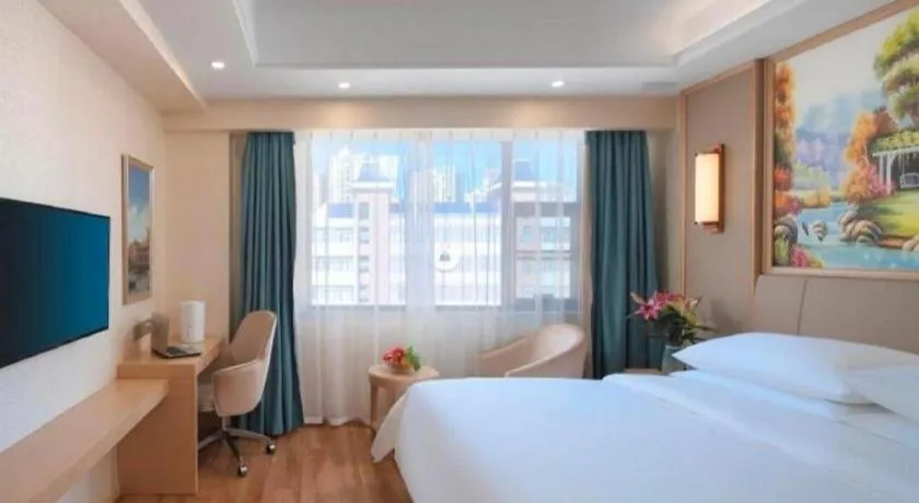 Bed in Vienna Hotel Kunming Baiyun Road Metro Station Jiang'an