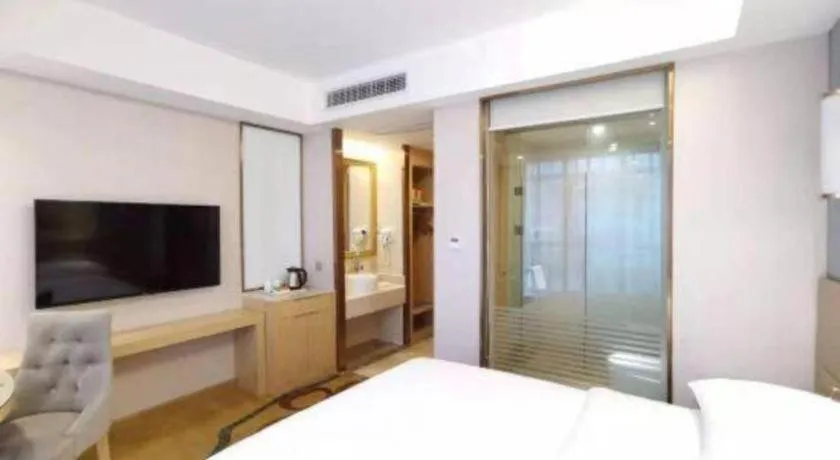 Bed in Vienna Hotel Chongqing Shiqiaopu Metro Station