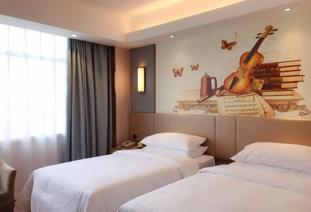 Bed in Vienna Hotel Chongqing Shiqiaopu Metro Station