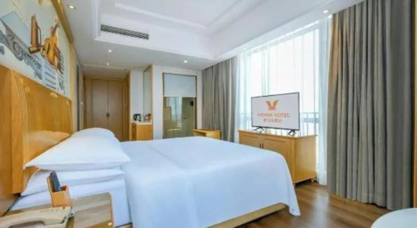 Bed in Vienna Hotel Chongqing Yangjiaping Pedestrian Street Light Railway Station