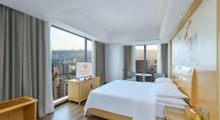 Bed in Vienna Hotel Chongqing Yangjiaping Pedestrian Street Light Railway Station