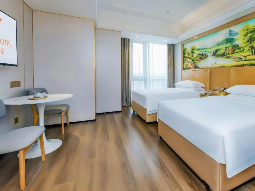 Bed in Vienna Hotel Chongqing Yangjiaping Pedestrian Street Light Railway Station