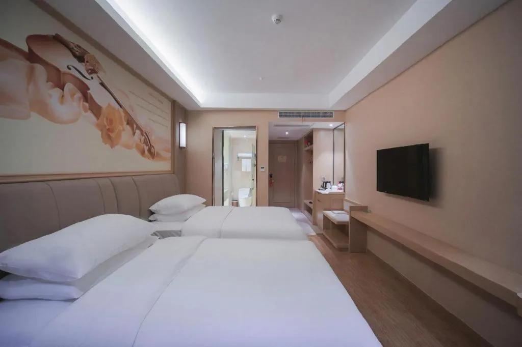 Bed in Vienna Hotel Chongqing Yangjiaping Pedestrian Street Light Railway Station