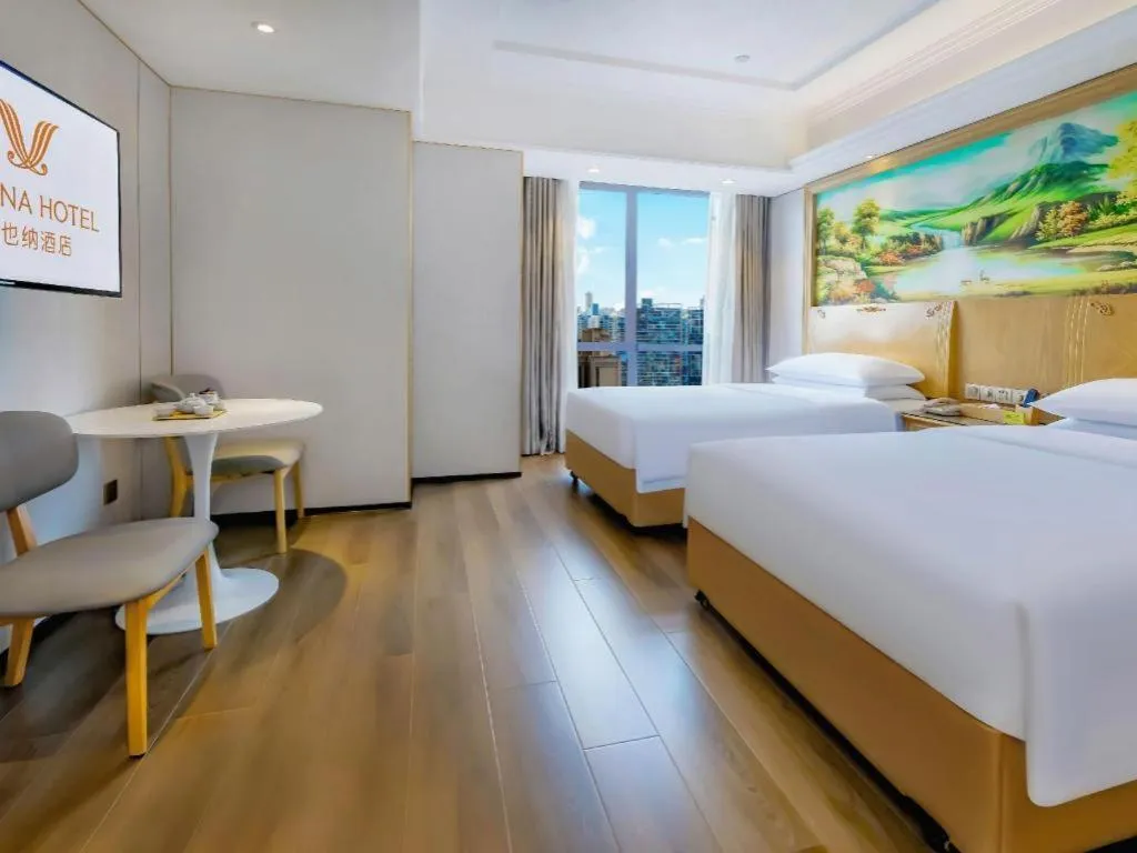 Bed in Vienna Hotel Chongqing Yangjiaping Pedestrian Street Light Railway Station