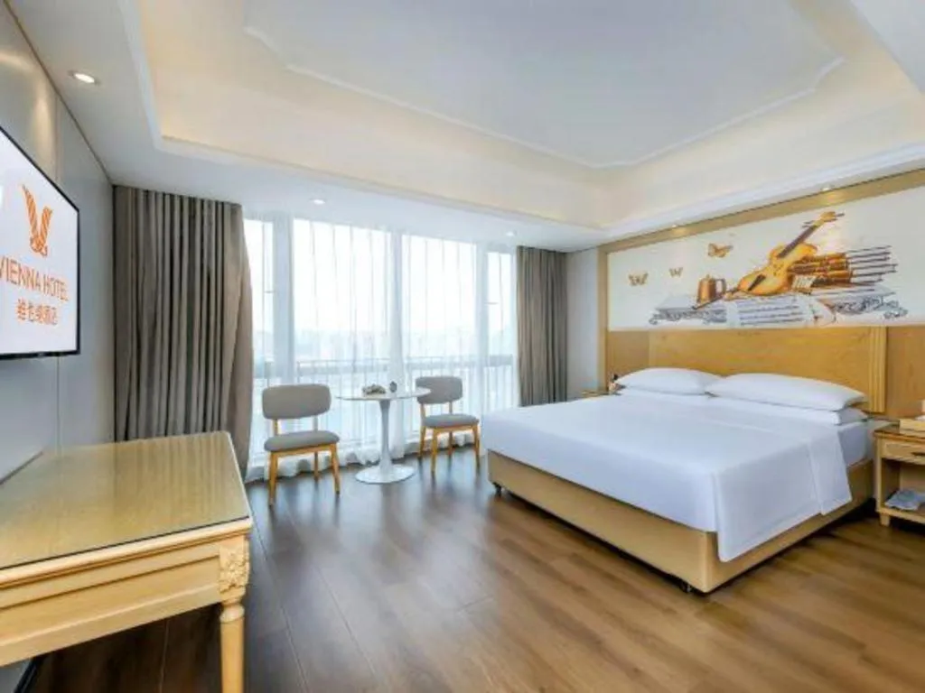 Bed in Vienna Hotel Chongqing Yangjiaping Pedestrian Street Light Railway Station