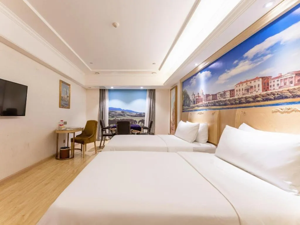 Bed in Vienna Hotel Chongqing Yangjiaping Pedestrian Street Light Railway Station