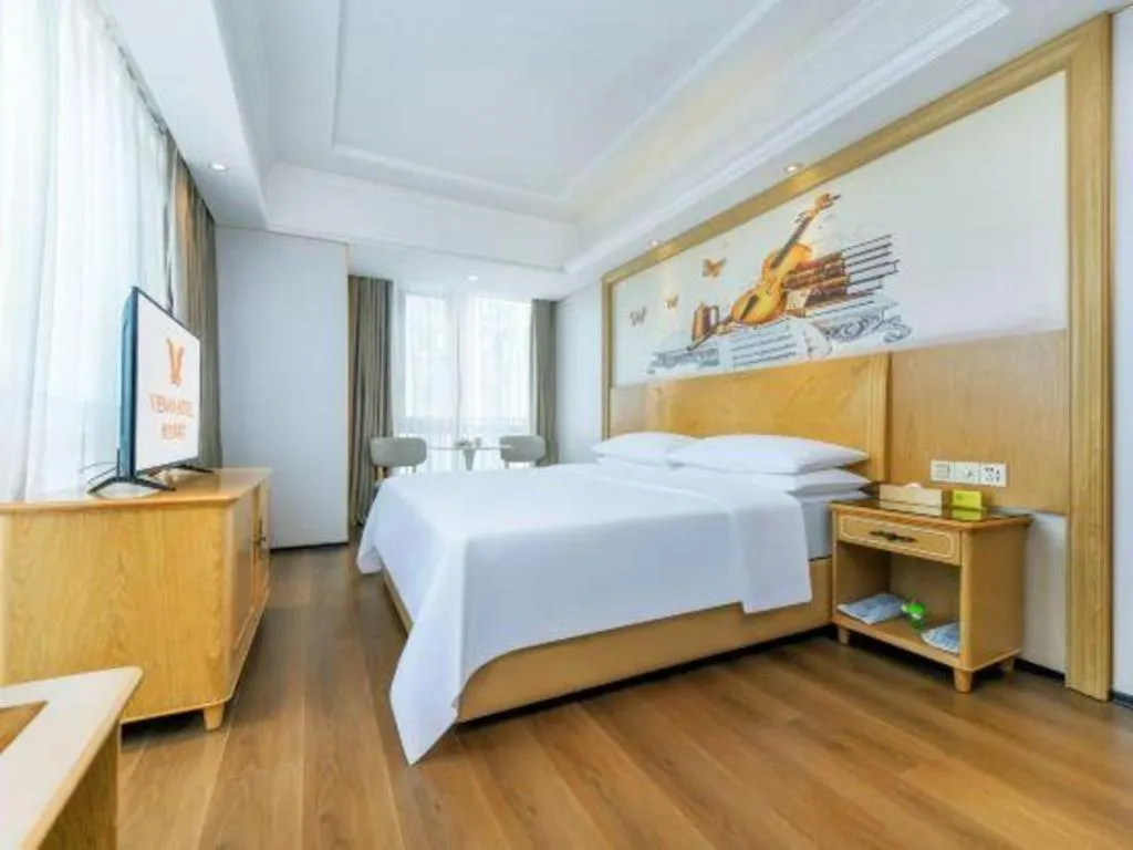 Bed in Vienna Hotel Chongqing Yangjiaping Pedestrian Street Light Railway Station