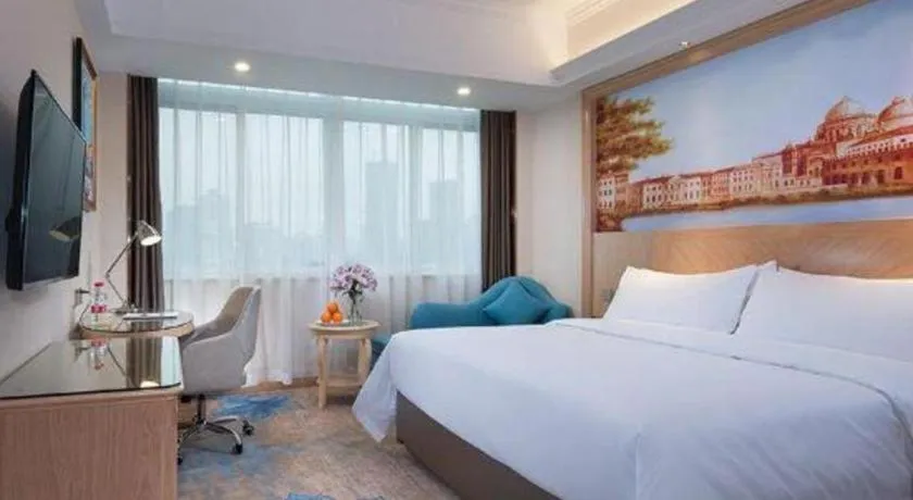 Bed in Vienna Hotel Chongqing Yangjiaping Pedestrian Street Light Railway Station