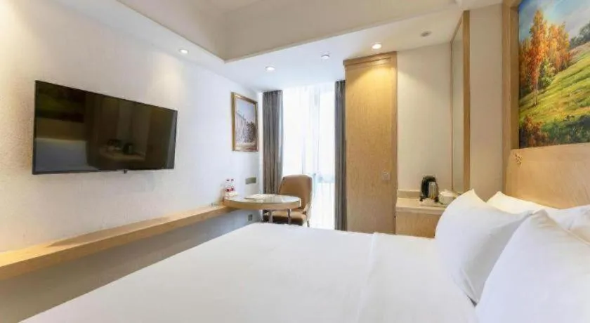 Bed in Vienna Hotel Chongqing Yangjiaping Pedestrian Street Light Railway Station