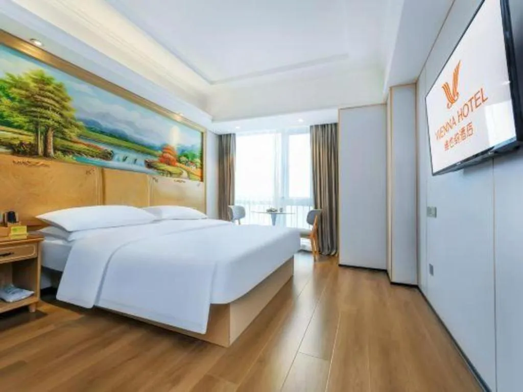 Bed in Vienna Hotel Chongqing Yangjiaping Pedestrian Street Light Railway Station