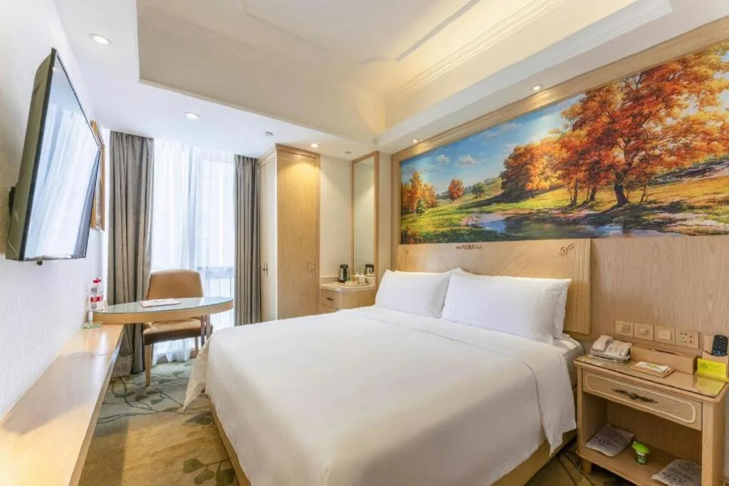 Bed in Vienna Hotel Chongqing Yangjiaping Pedestrian Street Light Railway Station