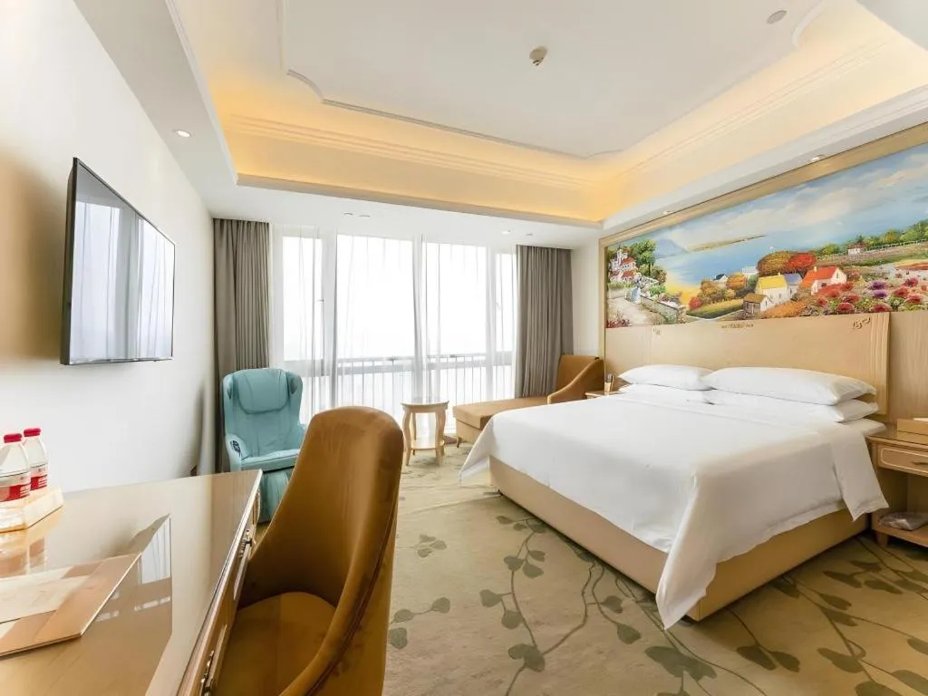 Bed in Vienna Hotel Chongqing Yangjiaping Pedestrian Street Light Railway Station